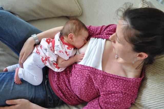 Mother laid back breastfeeding