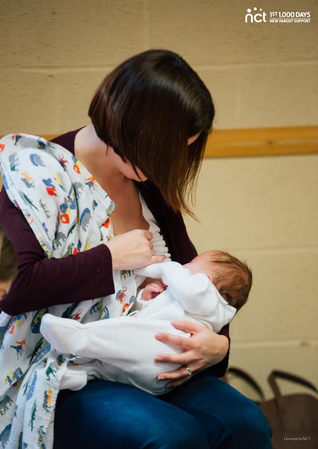 Mother breastfeeding a young baby